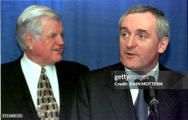 Irish Prime Minister Bertie Ahern speaks with the press after receiving a bust of President John F. Kennedy, 15 December, from Senator Edward M....