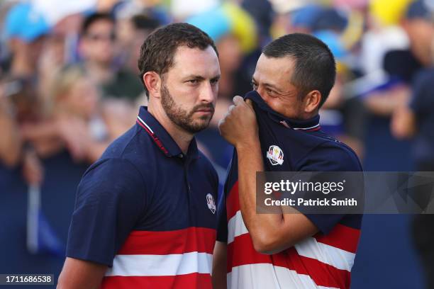 Patrick Cantlay and Xander Schauffele of Team United States talk following the Sunday singles matches of the 2023 Ryder Cup at Marco Simone Golf Club...