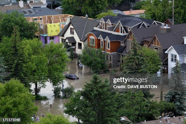 Flooded neighbourhood beside the flooded Bow River in Calgary, Alberta, Canada June 22, 2013. Water levels have dropped slightly today. AFP...