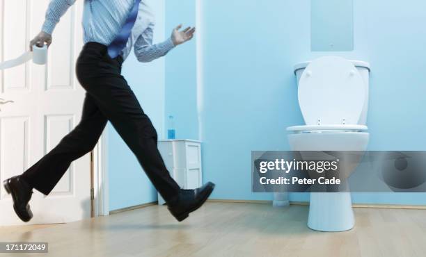 male executive running to toilet - top priority stock pictures, royalty-free photos & images