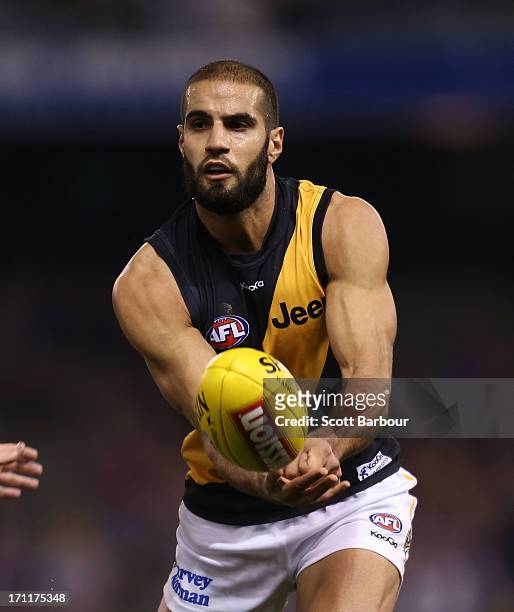Bachar Houli of the Tigers competes for the ball during the round 13 AFL match between the Western Bulldogs and the Richmond Tigers at Etihad Stadium...