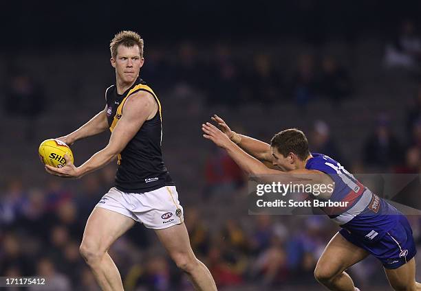 Jack Riewoldt of the Tigers runs with the ball during the round 13 AFL match between the Western Bulldogs and the Richmond Tigers at Etihad Stadium...