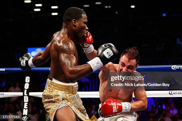 Paulie Malignaggi lands a punch on Adrien Broner during their WBA Welterweight Title bout at Barclays Center on June 22, 2013 in the Brooklyn borough...