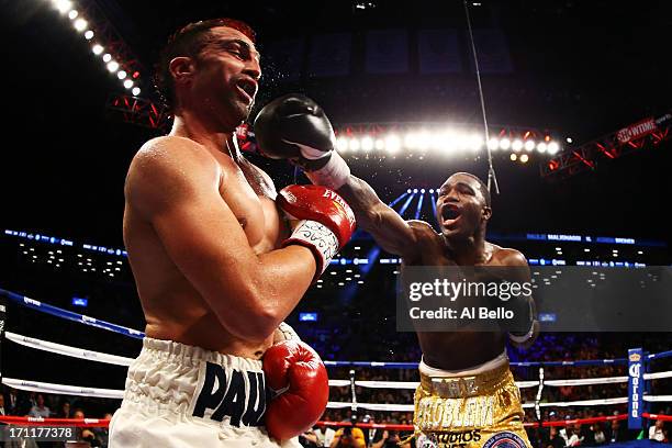 Adrien Broner lands a punch on Paulie Malignaggi during their WBA Welterweight Title bout at Barclays Center on June 22, 2013 in the Brooklyn borough...