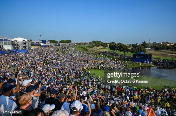 General view as fans surround the 18th green as Shane Lowry of Team Europe during the Sunday singles matches of the 2023 Ryder Cup at Marco Simone...