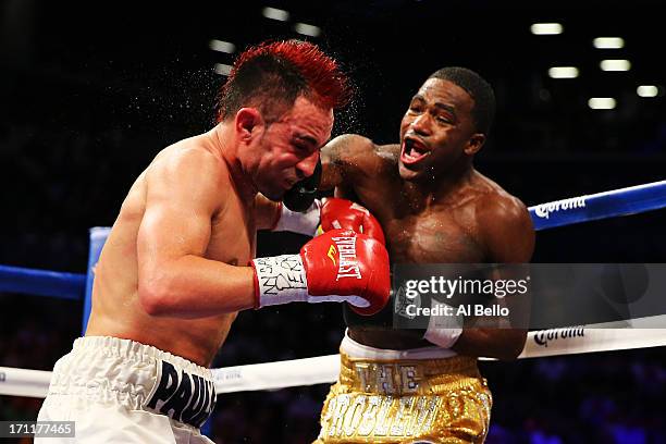 Adrien Broner lands a punch on Paulie Malignaggi during their WBA Welterweight Title bout at Barclays Center on June 22, 2013 in the Brooklyn borough...