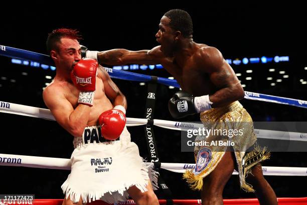 Adrien Broner lands a punch on Paulie Malignaggi during their WBA Welterweight Title bout at Barclays Center on June 22, 2013 in the Brooklyn borough...