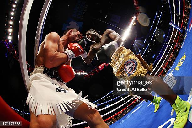 Adrien Broner lands a punch on Paulie Malignaggi during their WBA Welterweight Title bout at Barclays Center on June 22, 2013 in the Brooklyn borough...