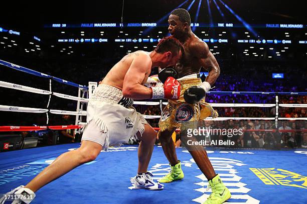 Paulie Malignaggi and Adrien Broner exchange blows during their WBA Welterweight Title bout at Barclays Center on June 22, 2013 in the Brooklyn...