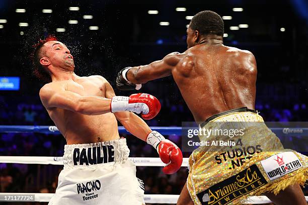 Adrien Broner lands a punch on Paulie Malignaggi during their WBA Welterweight Title bout at Barclays Center on June 22, 2013 in the Brooklyn borough...