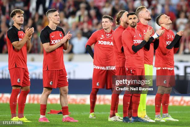 Sport-Club Freiburg players applaud the fans following the team's victory during the Bundesliga match between Sport-Club Freiburg and FC Augsburg at...