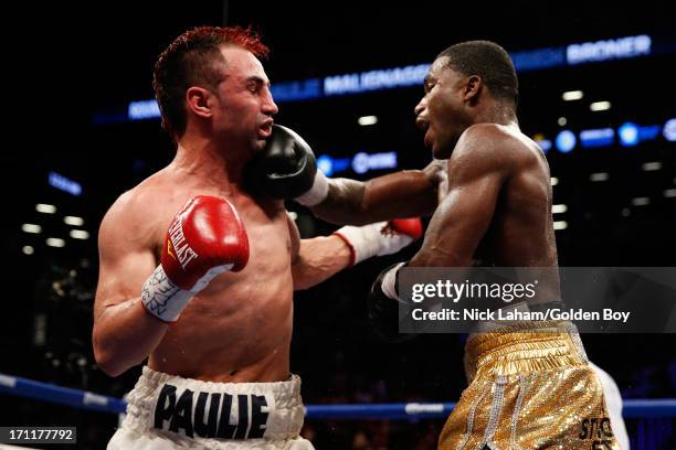 Adrien Broner lands a punch on Paulie Malignaggi during their WBA Welterweight Title bout at Barclays Center on June 22, 2013 in the Brooklyn borough...