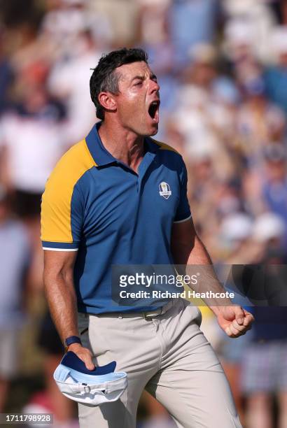 Rory McIlroy of Team Europe celebrates winning his match on the 17th green during the Sunday singles matches of the 2023 Ryder Cup at Marco Simone...