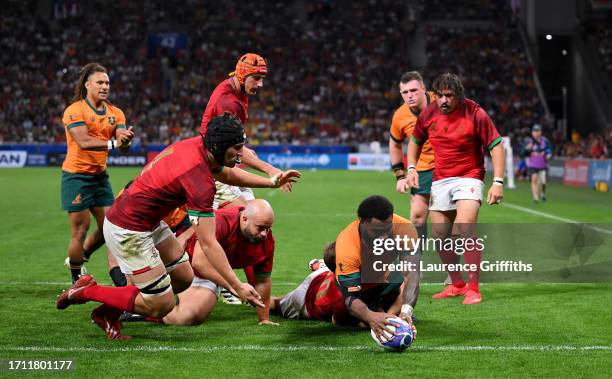 Marika Koroibete of Australia scores his team's fifth try during the Rugby World Cup France 2023 match between Australia and Portugal at Stade...