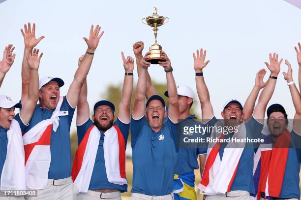 Team Europe Captain Luke Donald lifts the trophy after Europe won 16.5pts to 11.5pts during the Sunday singles matches of the 2023 Ryder Cup at Marco...