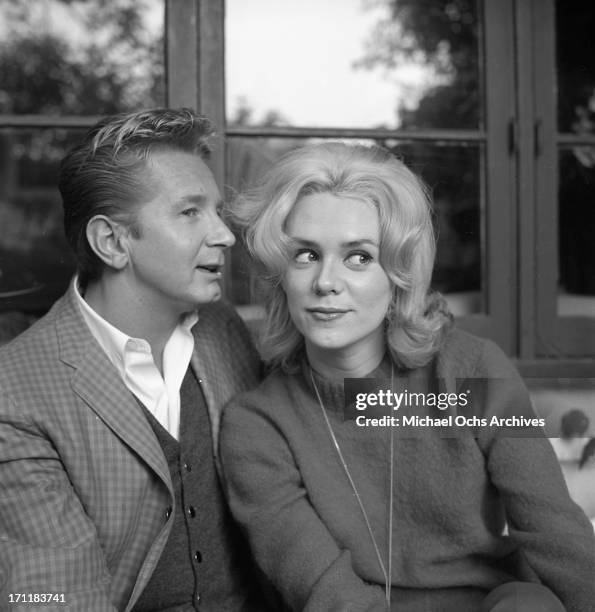 Singer/songwriter Jackie DeShannon poses for a portrait session at home with actor Kenny Miller in circa 1964 in Los Angeles, California.