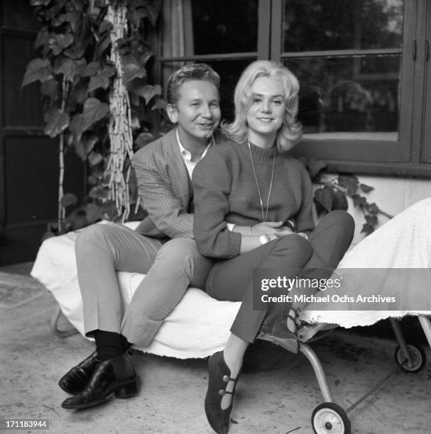 Singer/songwriter Jackie DeShannon poses for a portrait session at home with actor Kenny Miller in circa 1964 in Los Angeles, California.