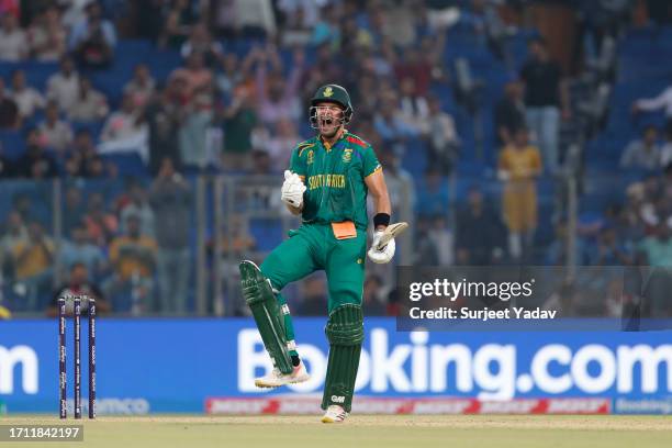 Aiden Markram of the South Africa celebrates after scoring a century during the ICC Men's Cricket World Cup India 2023 between South Africa and Sri...