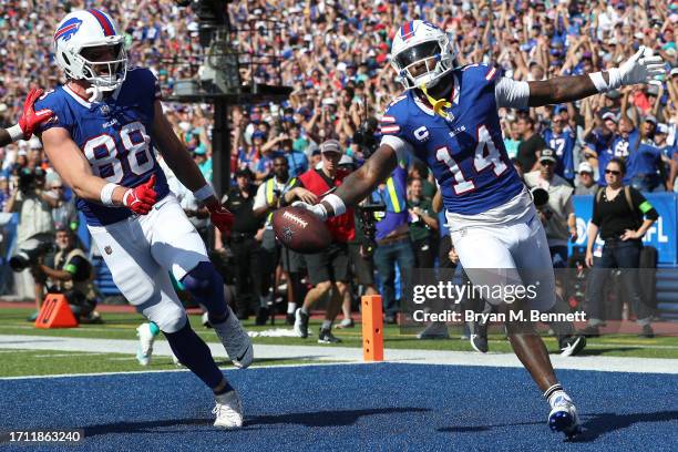 Stefon Diggs of the Buffalo Bills celebrates his touchdown reception with Dawson Knox during the second quarter against the Miami Dolphins at...