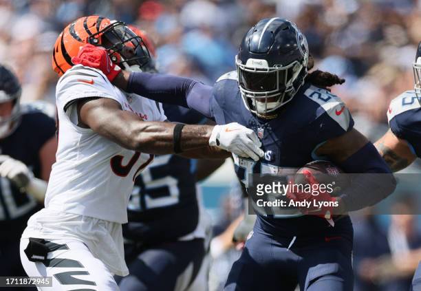 Derrick Henry of the Tennessee Titans rushes against the Cincinnati Bengals during the second quarter at Nissan Stadium on October 01, 2023 in...