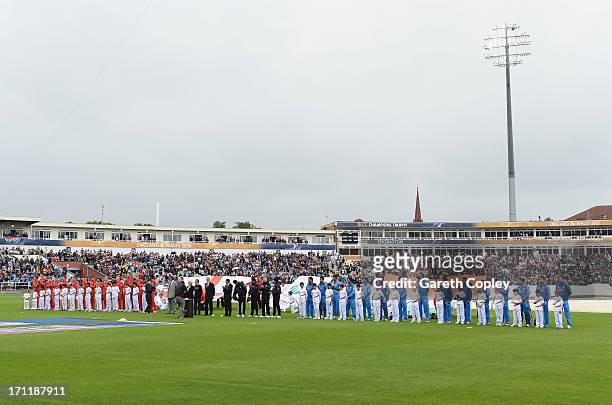 The teams line up for the national anthems prior to the ICC Champions Trophy Final between England and India at Edgbaston on June 23, 2013 in...