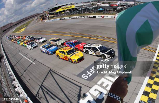 Aric Almirola, driver of the Smithfield Ford, leads the field to the green flag to start the NASCAR Cup Series YellaWood 500 at Talladega...