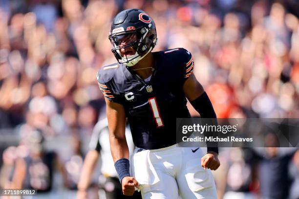 Justin Fields of the Chicago Bears celebrates a touchdown during the third quarter against the Denver Broncos at Soldier Field on October 01, 2023 in...