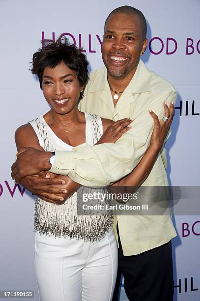 Angela Bassett and Eriq La Salle pose together for a photo at the Hollywood Bowl Hall Of Fame Opening Night at The Hollywood Bowl on June 22, 2013 in...