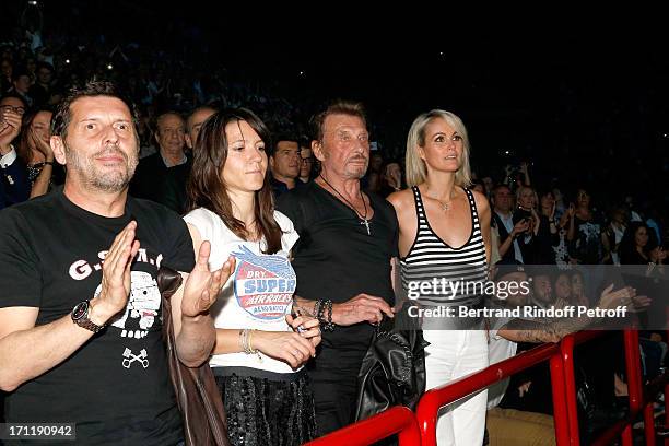 Director Pascal Duchene with companion Hortense d'Esteve, Singer Johnny Hallyday and his wife Laeticia Hallyday in the stand while Patrick Bruel...