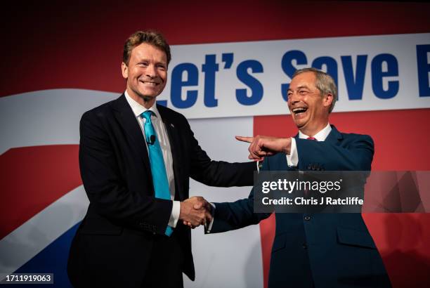 Reform Party leader, Richard Tice, and founding member, Nigel Farage, on stage at the Reform Party annual conference on October 7, 2023 in London,...