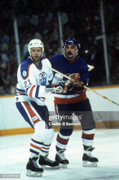 Randy Gregg of the Edmonton Oilers defends against Bryan Trottier of the New York Islanders during the 1984 Stanley Cup Finals in May, 1984 at the...