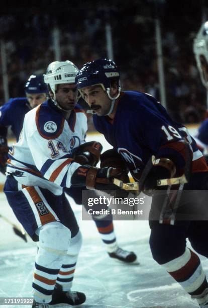 Bryan Trottier of the New York Islanders skates on the ice as Ray Cote of the Edmonton Oilers defends during the 1984 Stanley Cup Finals in May, 1984...