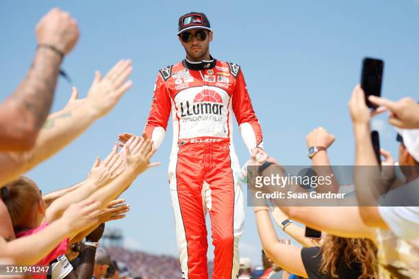 Chase Elliott, driver of the LLumar Chevrolet, greets fans as he walks onstage during driver intros prior to the NASCAR Cup Series YellaWood 500 at...