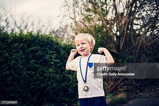 happy smiling little boy with a medal - medal of honor fotografías e imágenes de stock