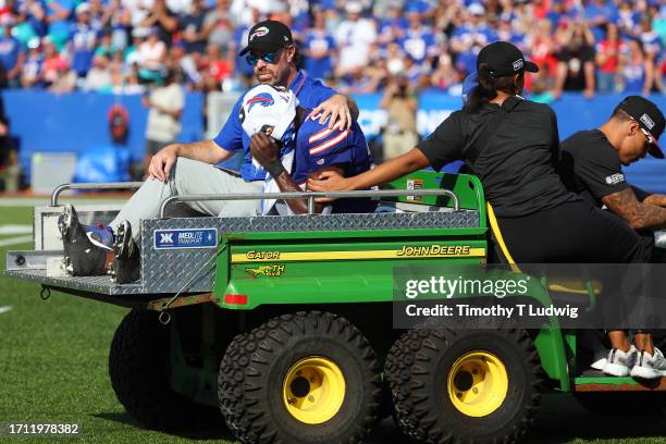 Tre'Davious White of the Buffalo Bills leaves the field on a medical cart after being injured during the third quarter against the Miami Dolphins at...