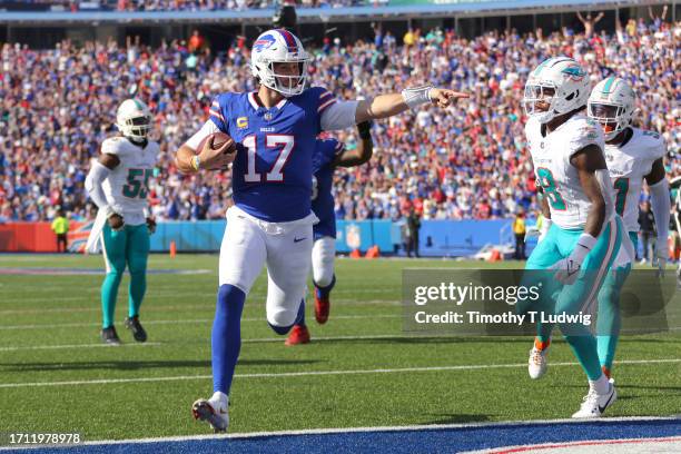 Josh Allen of the Buffalo Bills runs the ball for a touchdown against the Miami Dolphins during the fourth quarter at Highmark Stadium on October 01,...