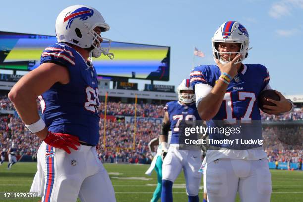 Josh Allen of the Buffalo Bills celebrates his touchdown run against the Miami Dolphins during the fourth quarter at Highmark Stadium on October 01,...