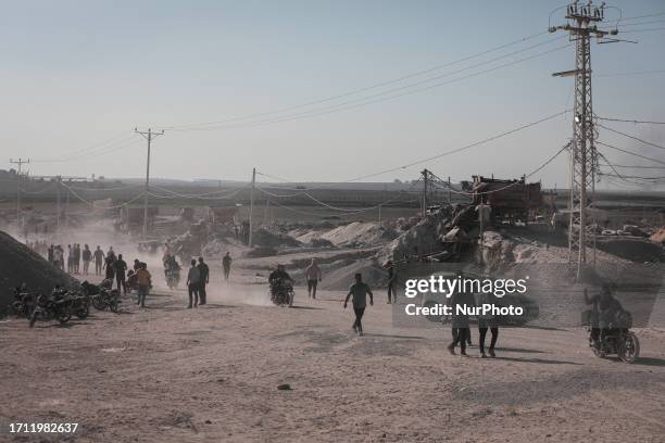 Fires break out at the Nahal Oz military site after Palestinian resistance fighters entered it. A group of Palestinian citizens appear at the Nahal...