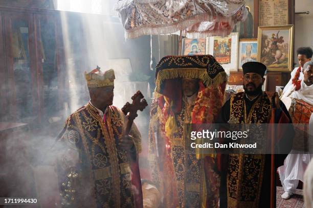 Sacred Tabot, dressed in a gold-fringed ornate gown, with a silver parasol is paraded through the Ethiopian Orthodox Church St Mary during a joint...