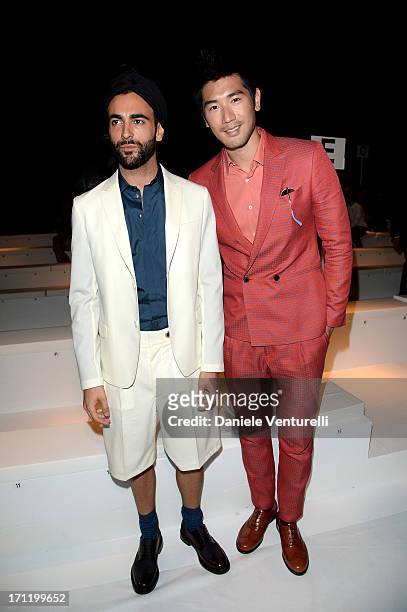 Godfrey Gao and Marco Mengoni attend the 'Salvatore Ferragamo' show as part of Milan Fashion Week Spring/Summer 2014 on June 23, 2013 in Milan, Italy.