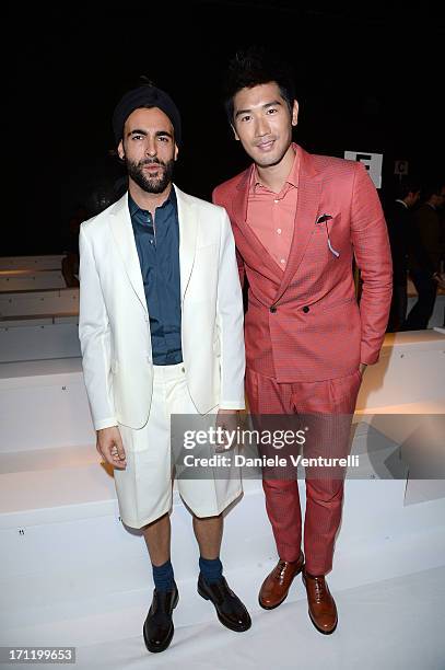 Godfrey Gao and Marco Mengoni attend the 'Salvatore Ferragamo' show as part of Milan Fashion Week Spring/Summer 2014 on June 23, 2013 in Milan, Italy.