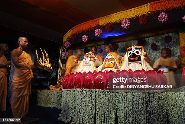 Hindu devotees of International Society for Krishna Consciousness perform rituals as a part of Snana Yatra festival of Lord Jagannath , in Kolkata on...