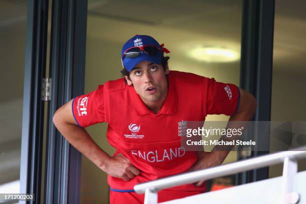 Alastair Cook the captain of England looks out from the dressing room as rain falls preventing play during the ICC Champions Trophy Final match...