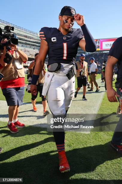 Justin Fields of the Chicago Bears leaves the field after the game against the Denver Broncos at Soldier Field on October 01, 2023 in Chicago,...