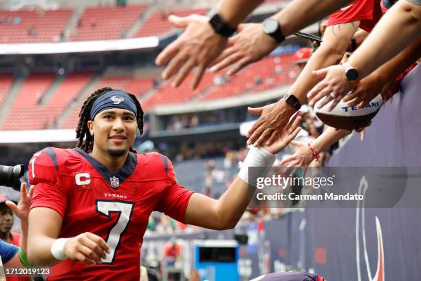 Stroud of the Houston Texans high fives fans after his team's 30-6 win against the Pittsburgh Steelers at NRG Stadium on October 01, 2023 in Houston,...