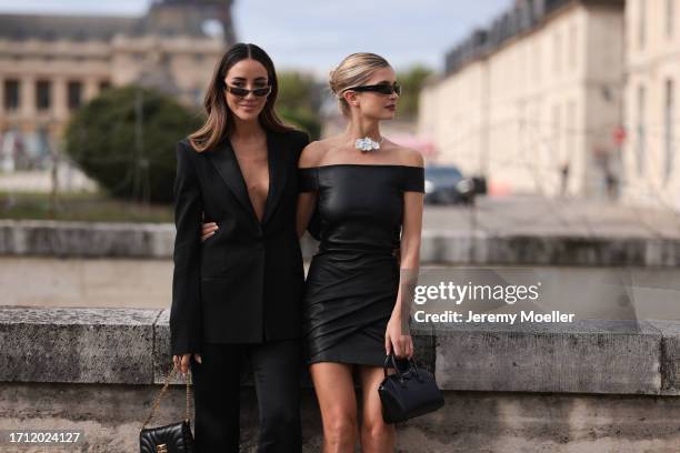 Tamara Kalinic is seen wearing a black long-cut blazer and black trousers, black sunglasses with gold details and a black leather handbag from...