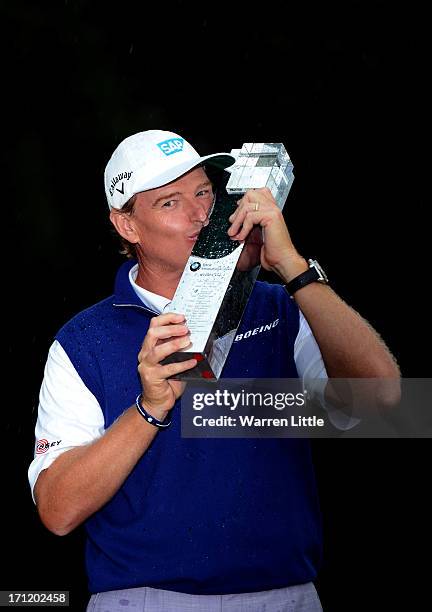 Ernie Els of South Africa poses with the trophy after winning the BMW International Open at Golfclub Munchen Eichenried on a score of -18 under par...