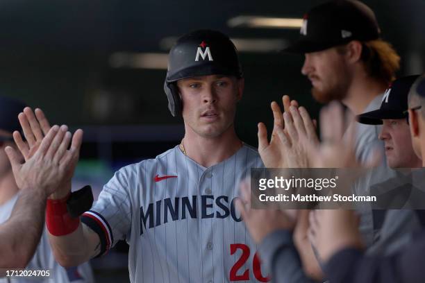 Max Kepler of the Minnesota Twins celebrates in the dugout after scoring on a Edouard Julien single against the Colorado Rockies in the second inning...