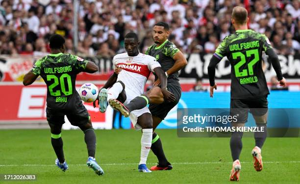 Wolfsburg's German midfielder Ridle Baku, Stuttgart's Guinean forward Serhou Guirassy, Wolfsburg's French defender Maxence Lacroix and Wolfsburg's...