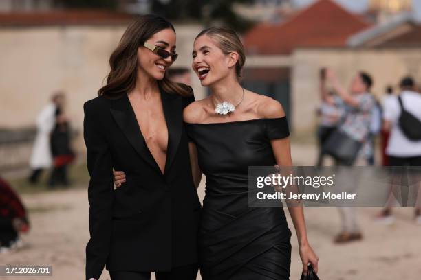 Tamara Kalinic is seen wearing a black long-cut blazer and black trousers, black sunglasses with gold details and a black leather handbag from...